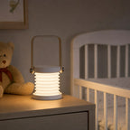 Soft lantern glow on a nursery dresser at night